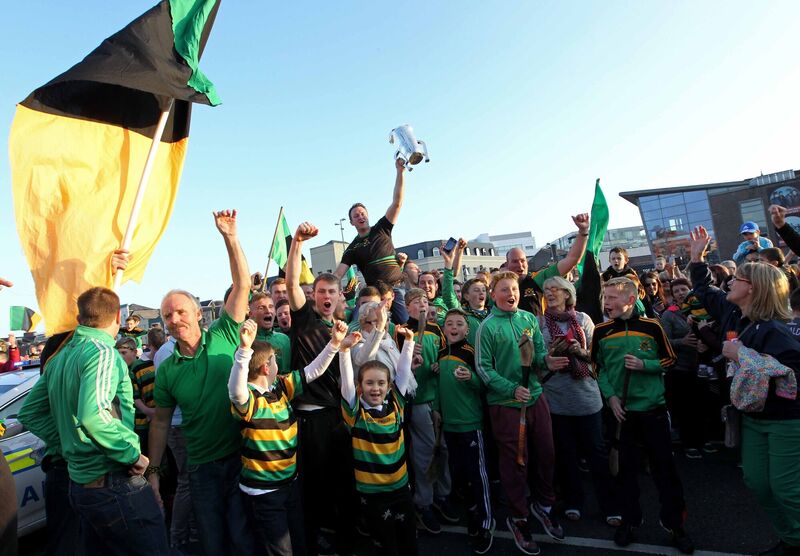Graham Callanan carries the cup over the Christy Ring Bridge in 2015. Picture: Jim Coughlan.