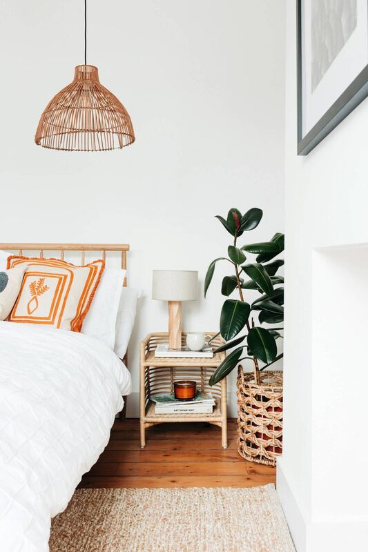 Use natural materials like wood, rattan, and stone and include a plant in a bedroom to create a connection with nature. 