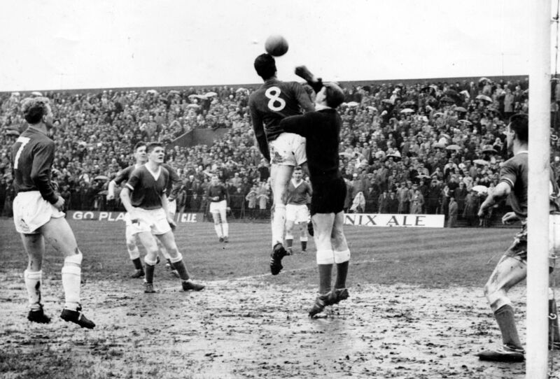 Cork Hibs keeper Bobby Brohan about to punch the ball away from the head of Shels Ben Hannigan during the 1960 FAI Cup final at Dalymount. Cork Hibs keeper Bobby Brohan about to punch the ball away from the head of Shels Ben Hannigan during the 1960 FAI Cup final at Dalymount.