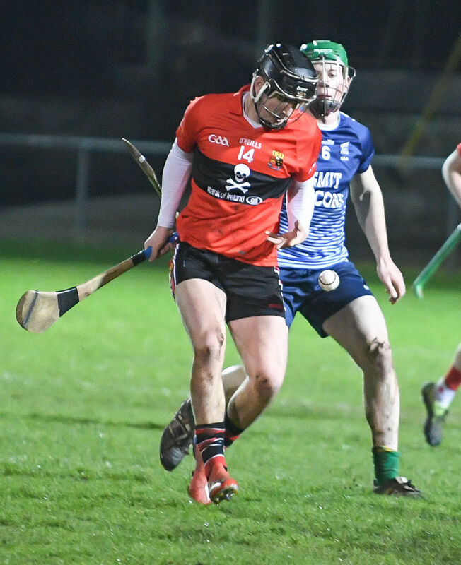 UCC's Padraig Power in a race for the ball with GMIT's Peadar Scally. Picture: David Keane.