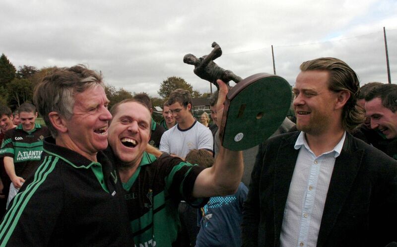 Nemo Rangers' Alan Cronin celebrating his City Division JAHC final Man of the Match award with trainer Jim Cremin after it was presented by Eoin Daly. Picture: Richard Mills.