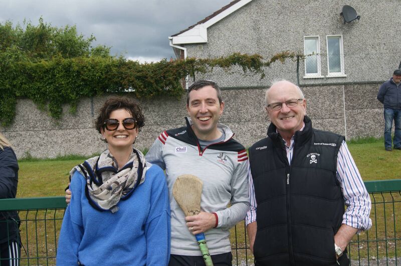 Deirdre and Shane McCarthy, with Dr Paddy Crowley, cheering on Ballincollig's Cal McCarthy at the Cashman Cup.