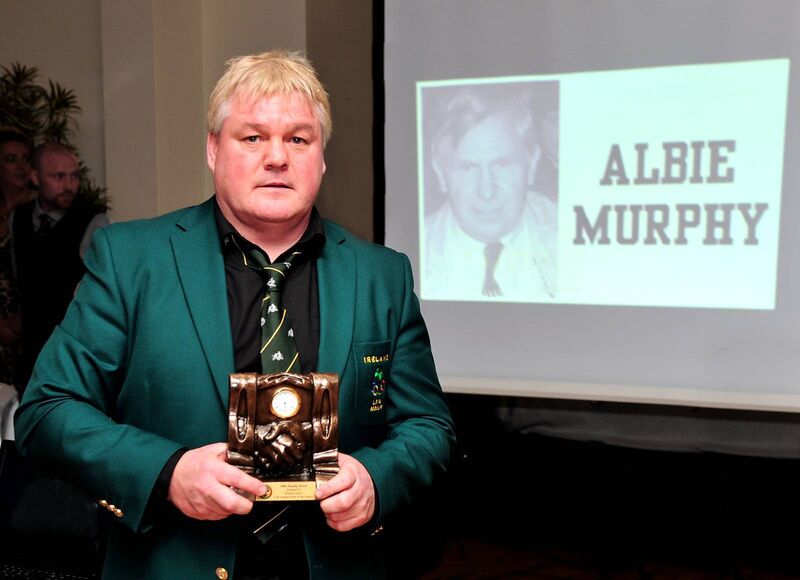 Kieran Joyce in front of a screenshot of his coach and mentor Albie Murphy, with his Cork Boxer Of The Century Award following the presentation at the Boxing Centenary Dinner Dance in 2014. Picture: Doug MInihane