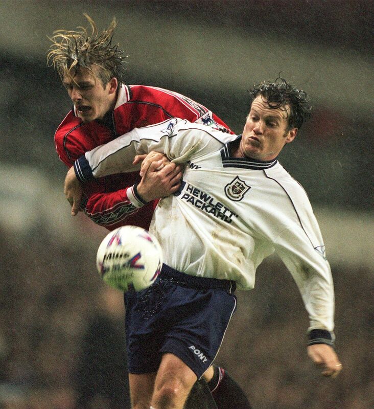 Andy Sinton battling David Beckham.