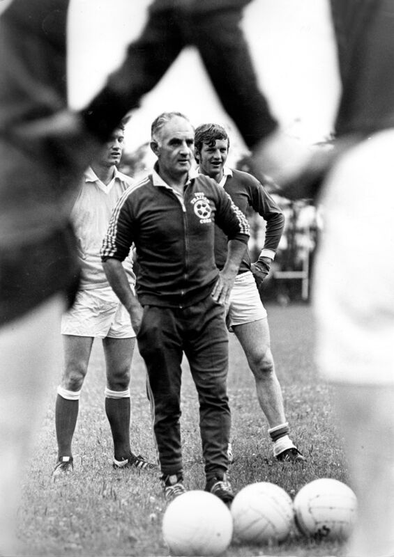 Donie O'Donovan at a training session for the Cork football team, watched by Jimmy Barry-Murphy and Declan Barron.