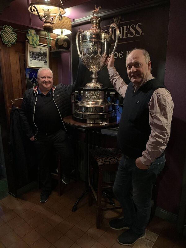 Tomás Singleton and trainer Eugene O'Sullivan with the Foxhunters Chase Trophy won by 66/1 shot It came to Pass at Cheltenham.