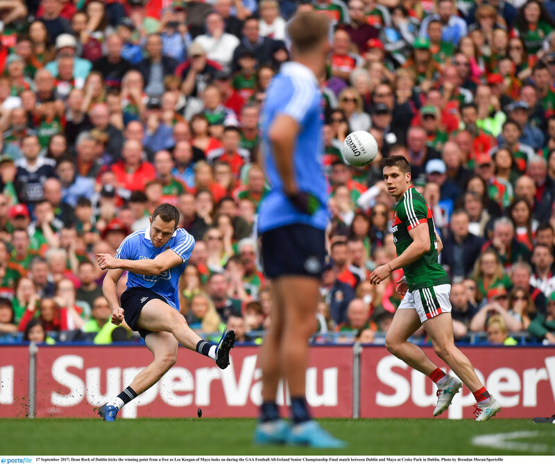 Dean Rock of Dublin kicks the winning point from a free as Lee Keegan of Mayo looks on. Picture: Brendan Moran/Sportsfile