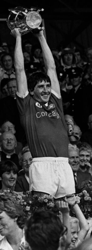 John Fenton lifts the Liam McCarthy Cup after Cork’s win over Offaly in 1984.