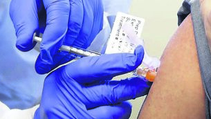 <p class="contextmenu internal_Caption">SHOT IN THE ARM: A patient receives a shot in the first-stage safety study clinical trial of a potential vaccine for COVID-19 in Seattle</p>