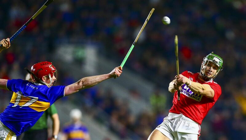 Cork's Alan Cadogan shoots under pressure from Tipperary's Jerome Cahill. Picture: INPHO/Ken Sutton