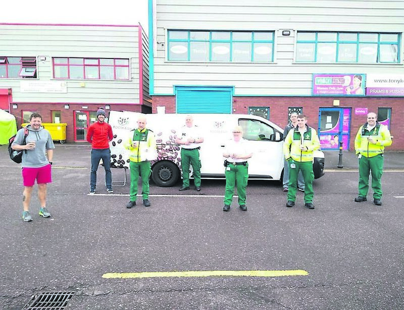 SPECIAL DELIVERY: Nick O’Donoghue (second left) with health workers grateful of some coffee and cakes and a quick break SPECIAL DELIVERY: Nick O’Donoghue (second left) with health workers grateful of some coffee and cakes and a quick break