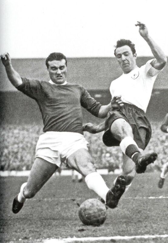 Noel Cantwell sliding in to tackle Jimmy Greaves.