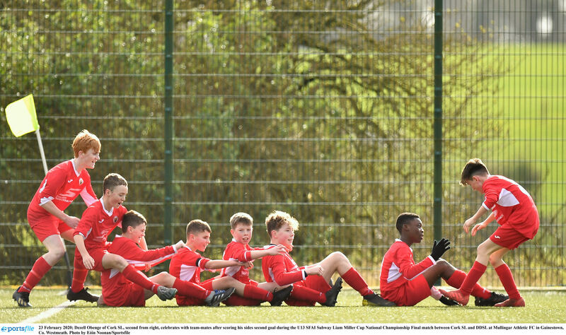 Dezell Obenge of Cork SL, second from right, celebrates with team-mates. Picture: Eóin Noonan/Sportsfile Dezell Obenge of Cork SL, second from right, celebrates with team-mates. Picture: Eóin Noonan/Sportsfile