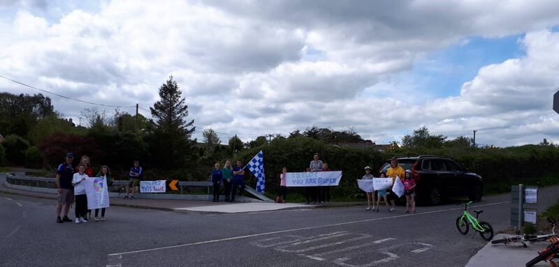 Neighbours came out to support Ellie on her cycle.