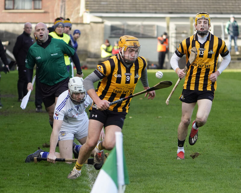 Kieran Walsh of Russell Rovers (Cork) manages to keep the ball in play despite a tackle from Sean O'Feinneadha of Micheál Breathnach (Galway) in the 2020 AIB GAA Hurling All-Ireland Junior Club Championship Semi-Final in Kilmallock, Co Limerick on Sunday.Pic: Don Moloney