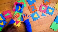 little girl playing with puzzle, early education