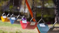 Empty colorful swings at the park