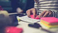 Girl peeling off sticky notes