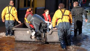 <p class="contextmenu internal_Caption">A PRESSING ISSUE: Mercy Hospital staff being taken by boat to work from Courthouse Street during the 2009 floods — an example of how extreme climate events can put huge pressure on the health service</p>