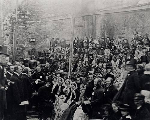 A very early photograph, showing John Gregg, Bishop of Cork, Cloyne and Ross, laying the foundation stone of St Fin Barre's Cathedral on 12 January 1865. The famous Victorian architect William Burges designed the cathedral, which was consecrated in 1870. The spires and towers were not completed until 1879. A very early photograph, showing John Gregg, Bishop of Cork, Cloyne and Ross, laying the foundation stone of St Fin Barre's Cathedral on 12 January 1865. The famous Victorian architect William Burges designed the cathedral, which was consecrated in 1870. The spires and towers were not completed until 1879.