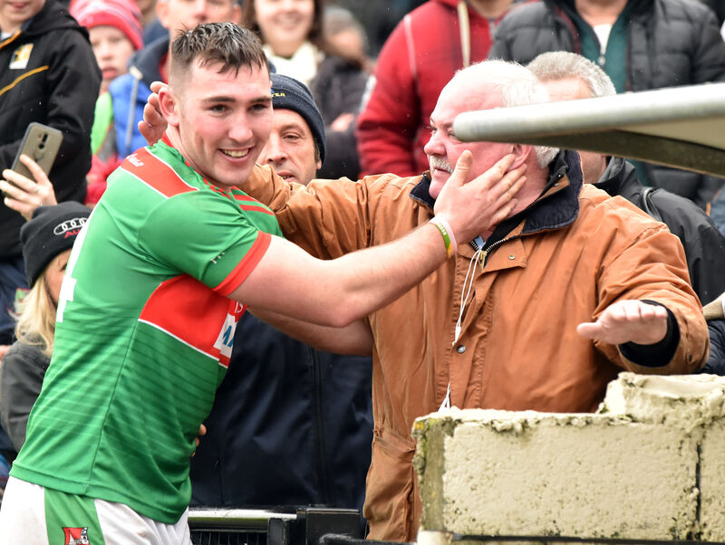 Fr O'Neill's Deccie Dalton celebrates with his father Robbie after the intermediate final. Picture: Eddie O'Hare Fr O'Neill's Deccie Dalton celebrates with his father Robbie after the intermediate final. Picture: Eddie O'Hare