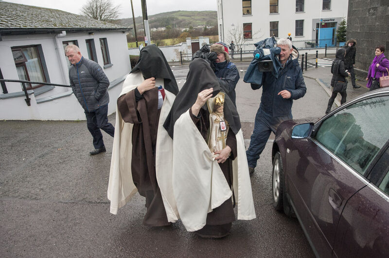 Sr Irene Gibson, Carmelite Nun of the Holy Face of Jesus pictured leaving Skibbereen District Court (carrying a 'Child of Prague' religious statue) and Sr Anne Marie of the Holy Family Carmelite Hermitage, Leap, Co Cork.Pic Daragh Mc Sweeney/Cork Courts