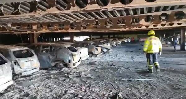 Still from video by Cork City Fire Brigade via their Twitter Account. Douglas Village Shopping Centre fire aftermath showing buckled steel beams.