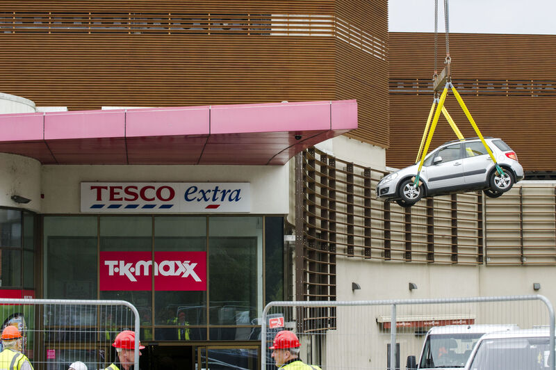 Cars are removed by crane from Douglas Village Shopping Centre, Cork following an accidental fire which severely damaged the multi-storey car park.Pic Daragh Mc Sweeney/Provision Cars are removed by crane from Douglas Village Shopping Centre, Cork following an accidental fire which severely damaged the multi-storey car park.Pic Daragh Mc Sweeney/Provision
