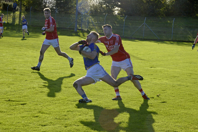 Kevin Manning (Iveleary) tries to halt Killian O'Hanlon, the captain of Kilshannig. Picture: Denis Boyle
