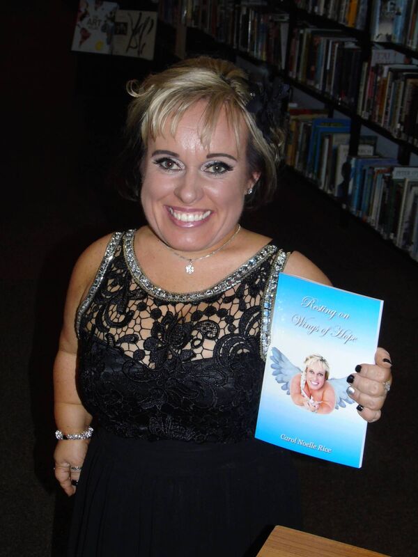 Carol Rice with her book, Resting on Wings of Hope. Carol Rice with her book, Resting on Wings of Hope.