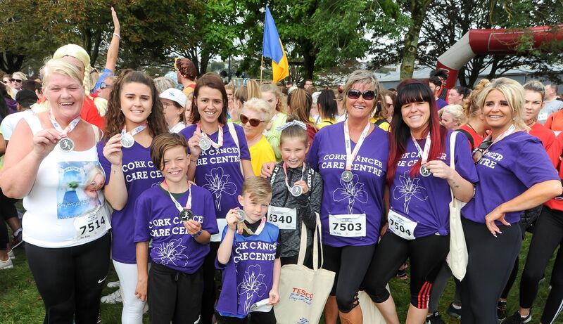 A happy group with their medals after running in the Echo Women's Mini Marathon. A happy group with their medals after running in the Echo Women's Mini Marathon.