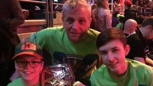 Gavin Lowen, his dad Bernard and brother Ben at his beloved WWE (wrestling) in Dublin. He adores John Cena.