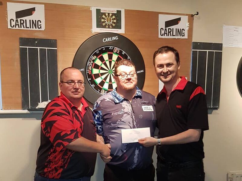 John O'Shea, the Cork Masters Men's Darts Champion 2019, with Mark Keohane and William McSweeney.