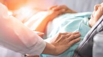 Healthcare concept of professional psychologist doctor consulting and comforting elderly patient in psychotherapy session or cou
