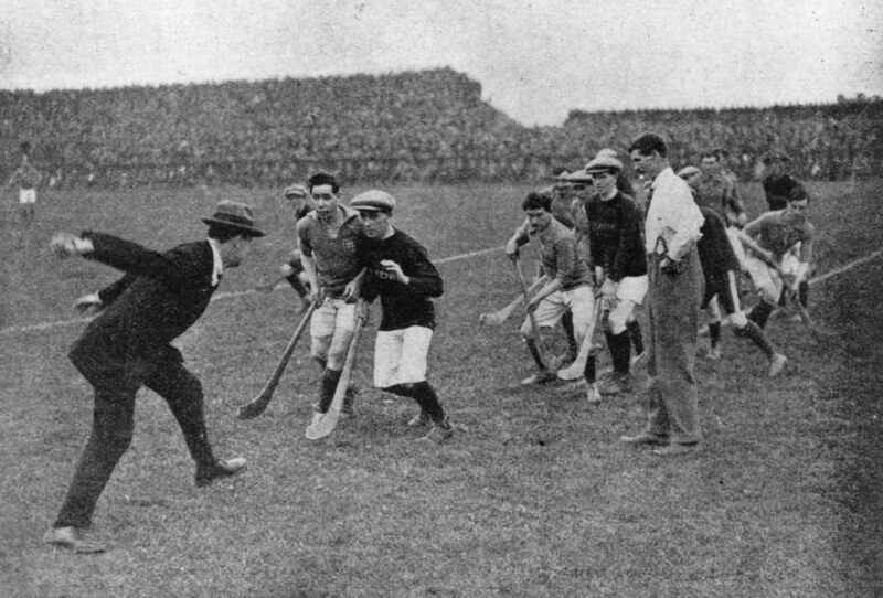 1921: Sinn Fein leader and Commander-In-Chief of the Irish Free State Army Michael Collins (1890 - 1922) throwing in the ball to start a hurling match at Croke Park, Dublin. 1921: Sinn Fein leader and Commander-In-Chief of the Irish Free State Army Michael Collins (1890 - 1922) throwing in the ball to start a hurling match at Croke Park, Dublin.