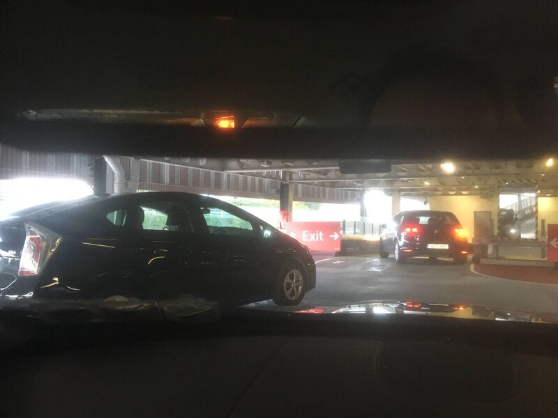 Picture taken by a shopper of cars departing the Douglas Shopping Centre just minutes before the floor was engulfed in flames. The car on fire can be seen in the rearview mirror.