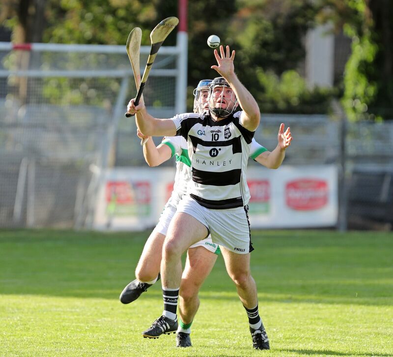Maurice O'Sullivan, Ballyhea, battles Liam Cashman, Kanturk. Picture: Jim Coughlan.
