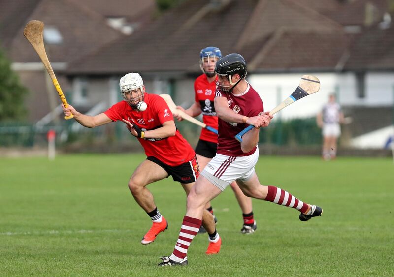 Shane O'Neill, Bishopstown, clears from Brian Verling, UCC. Picture: Jim Coughlan.