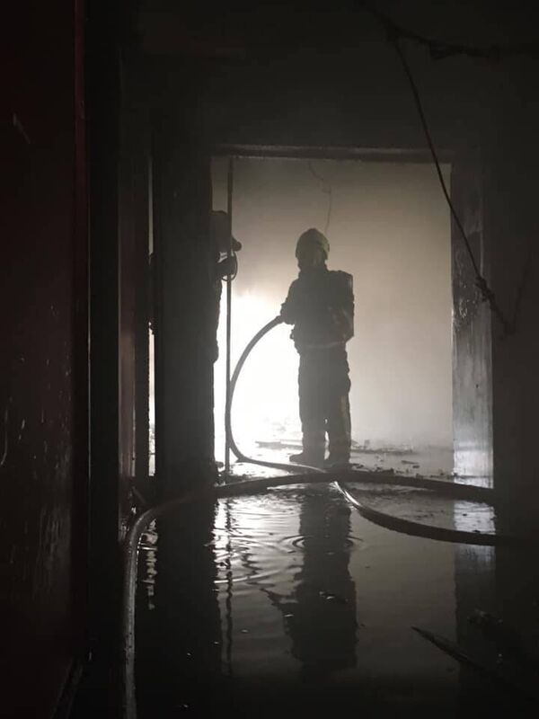 A member of the fire service at the scene in Blackpool. Picture: Cork City Fire Brigade. A member of the fire service at the scene in Blackpool. Picture: Cork City Fire Brigade.