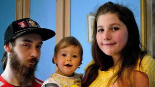 <p>THINKING OF THE FUTURE: Wren Alice Ind with her partner George Taylor and their daughter Lola at their home. Pictures: Shamim Malekmian</p>