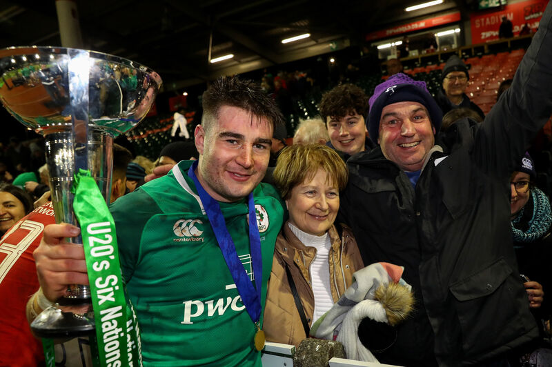 Ireland's John Hodnett celebrates with his family after the Grand Slam win. Picture: INPHO/Ryan Byrne