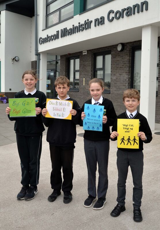 Pupils (from left) Máire Ní Fhinn, Pilib Mac Oistigín, Julie Ní Bhriain agus Óisín Ó Muirí with four green flag slogans.Picture Denis Minihane.