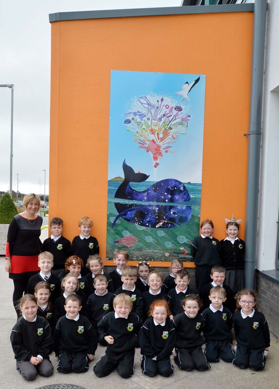 Rang 1 pupils with a mural set on composite aluminium designed by Grace Hamilton. Also in picture is múinteoir Gráinne Uí Chéitinn.Picture Denis Minihane.