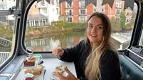 Enjoying afternoon tea on a vintage bus tour