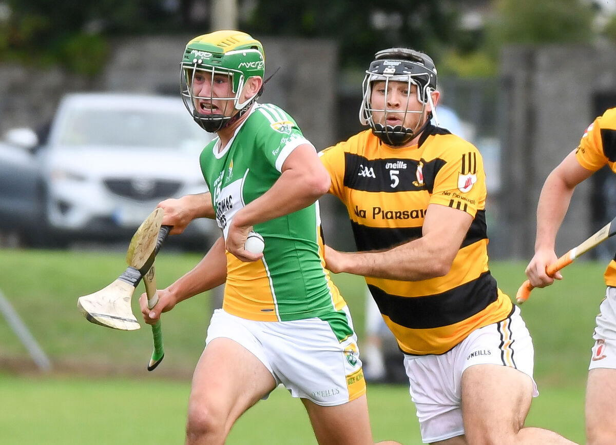 Bride Rovers' Brian Roche tries to get away from Na Piarsaigh's Christopher Joyce. Picture: David Keane.
