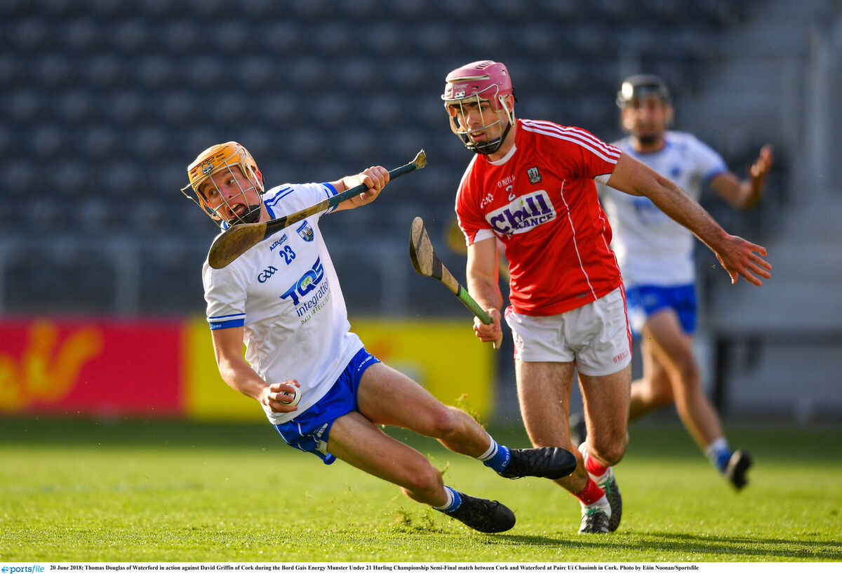 Thomas Douglas of Waterford in action against David Griffin of Cork. Picture: Eóin Noonan/Sportsfile Thomas Douglas of Waterford in action against David Griffin of Cork. Picture: Eóin Noonan/Sportsfile