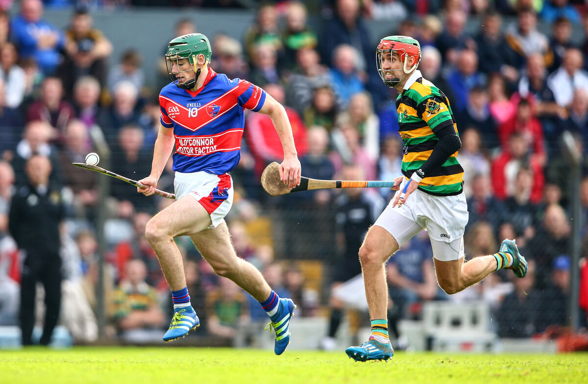 Erin's Own's Robbie O'Flynn solos past Stephan McDonnell of Glen Rovers. Picture: INPHO/Cathal Noonan