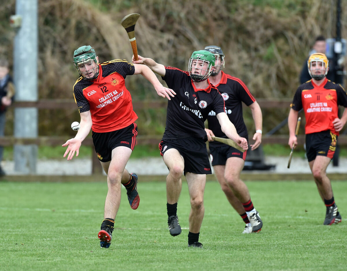 CBC's Robbie O'Flynn handpasses away from CBS High School Clonmel's Gavin Whelan. Picture: Eddie O'Hare