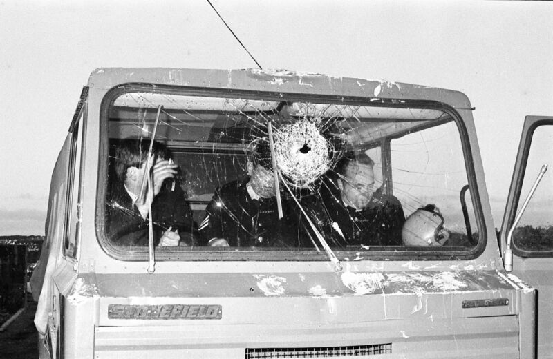 Gardaí in a truck damaged by rioters. Gardaí in a truck damaged by rioters.