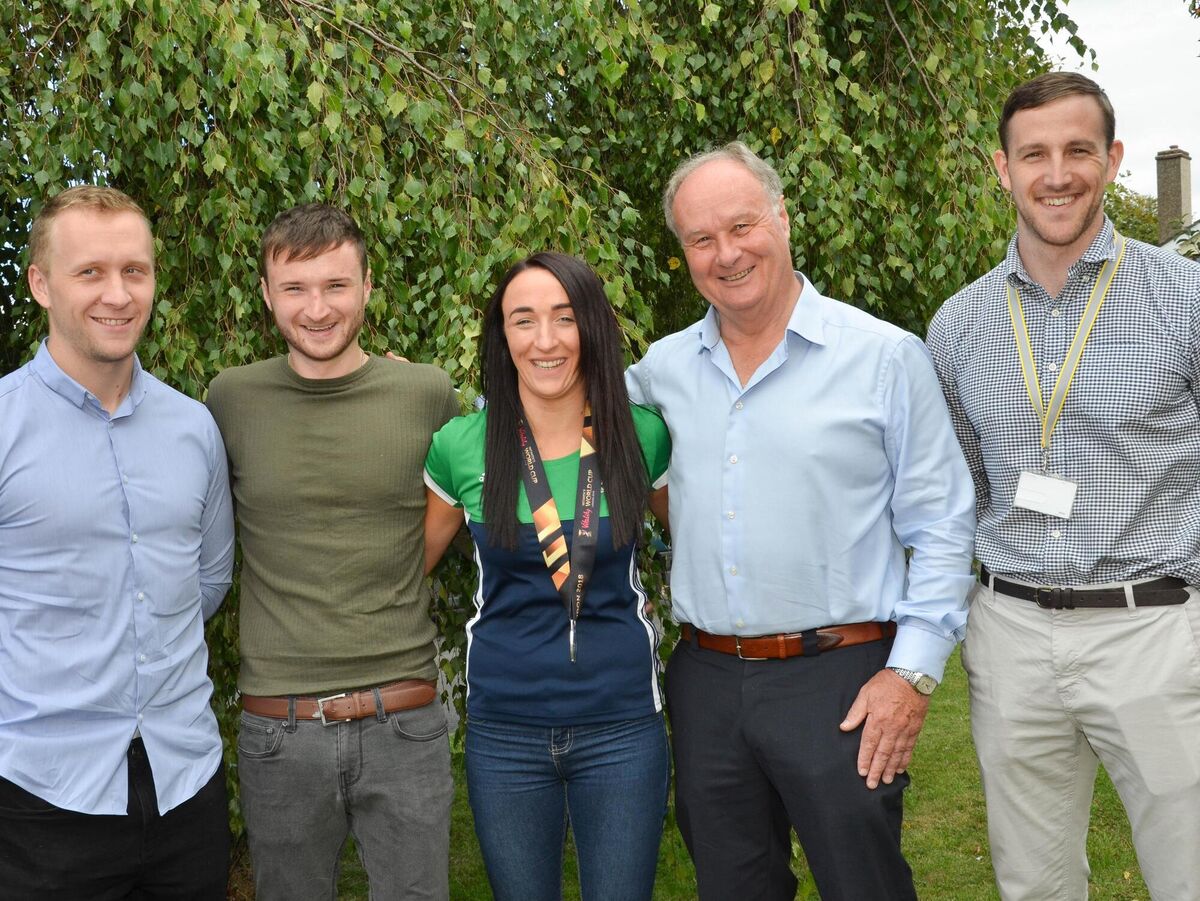 Yvonne O'Byrne, centre, who was part of the successful Irish Womens team which won Silver medal at the World Cup Hockey Finals recently, pictured with her brothers Niall and Lorcan, father Pat and boyfiend Cathal Owens at their home in Bishopstown. Picture: Howard Crowdy